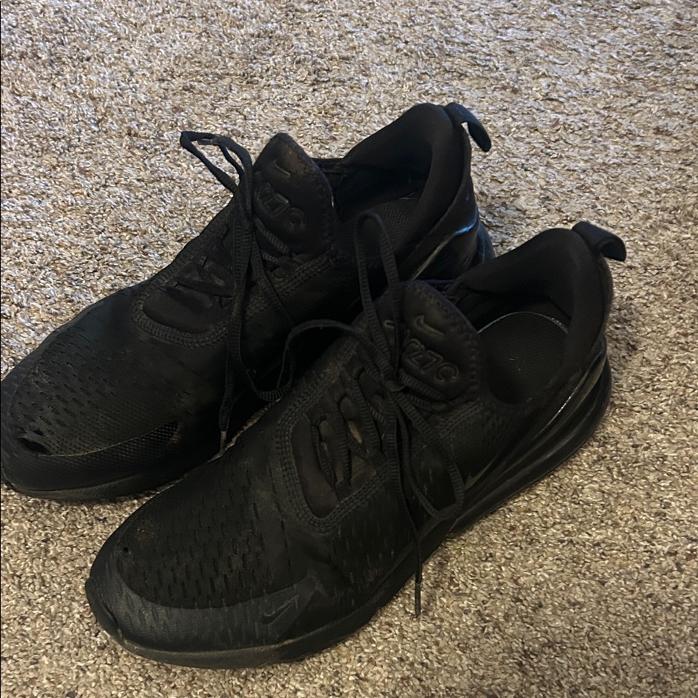 Nike Air Max 270 sneakers in the "Triple Black" colorway.